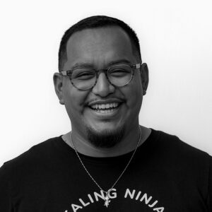 Black and white image of Hernan Carvente-Martinez who is increasing access to healing and wellness resources for communities of color in NYC.